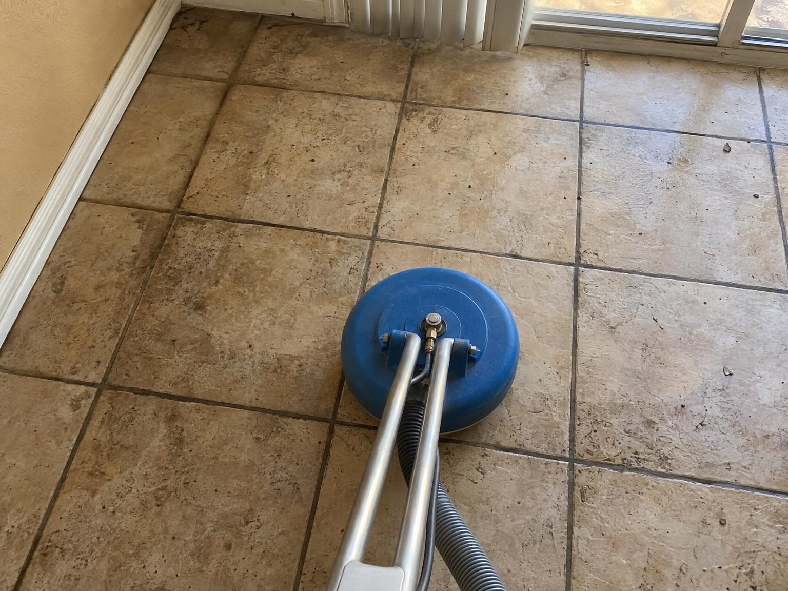 Spinner tool on dirty tile before cleaning