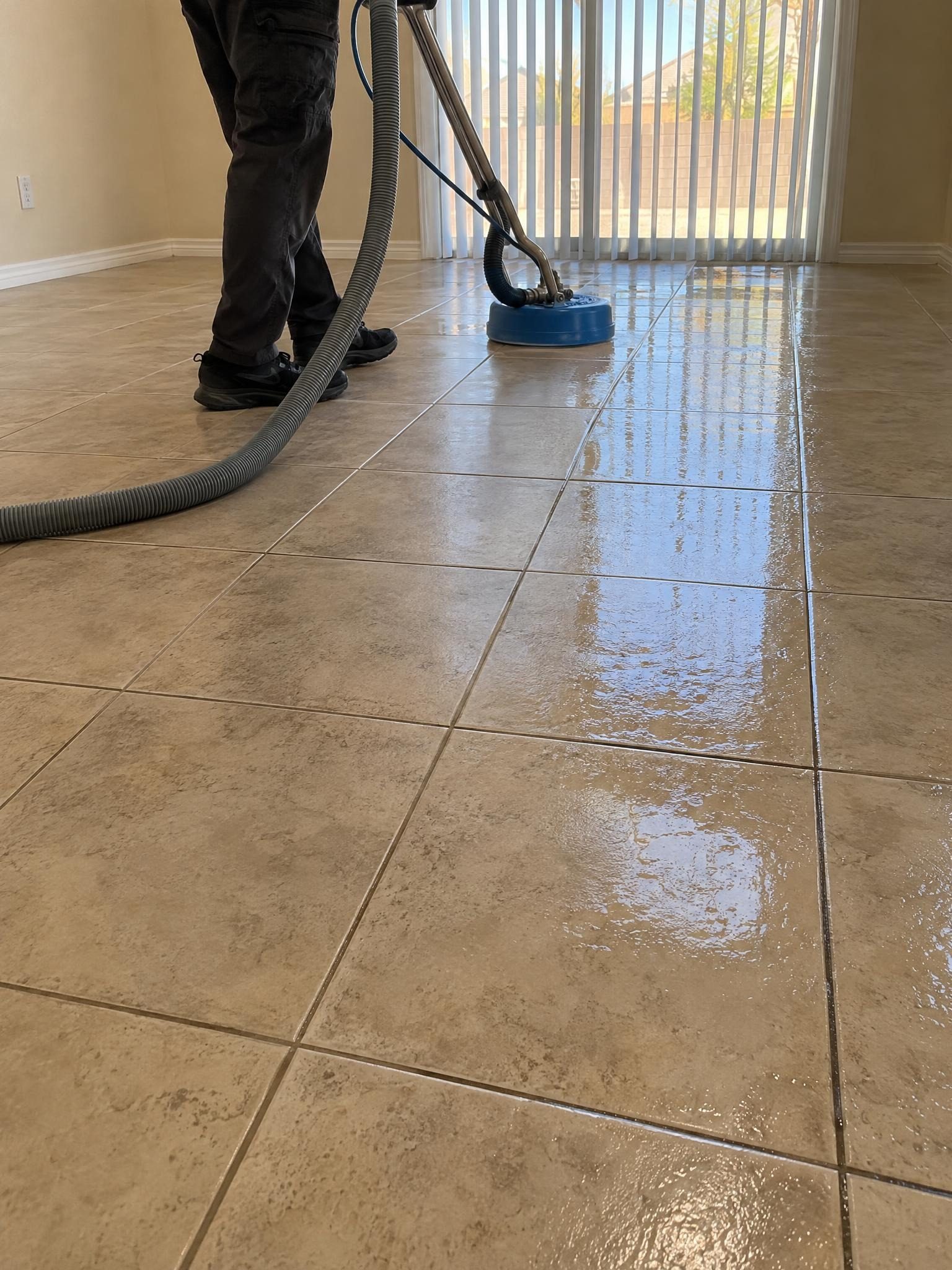 Steam cleaning a tile floor with the spinner tool